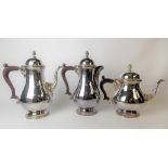 Modern silver matching teapot, coffee pot and hot water jug by Mappin & Webb, of pear pedestal form,