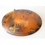 19th Century tortoiseshell gold applied hinge lidded oval box, decorated with a building, foliage