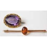 Victorian yellow metal amethyst oval brooch; together with a 9ct gold stone set bar brooch (2)