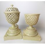 Pair of 19th Century creamware pedestal potpourri bowls, one with cover, the bowl of circular