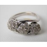 Modern 18ct white gold hallmarked diamond three-section daisy head ring, each diamond of 0.04ct