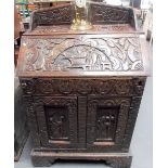 Victorian oak carved bureau with raised back, the fall front over two cupboard doors, width 85cm