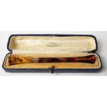 9ct rose gold mounted tortoiseshell cigarette holder within original fitted box, length 10cm.