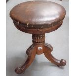Early 19th Century walnut adjustable piano stool with stuffover upholstered seat over a turned &