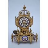 A bronze clock with porcelain (13x22x32cm)