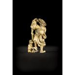 Japanese ivory netsuke 'man with oni', Meiji period (6cm)