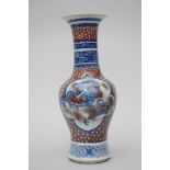 A vase in Chinese porcelain with underglaze blue and red decoration (*) (46cm)