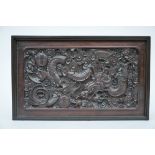 A Chinese panel in hardwood 'dragons' (43x26cm)