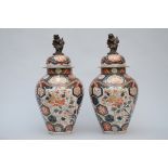 A pair of lidded vases in 'Imari' porcelain (63cm)