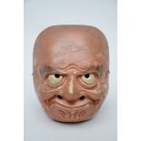 A red-brown Japanese mask in wood (15x18cm)