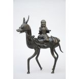 A Chinese bronze statue 'Laotsé on a deer' (*) (29x35cm)