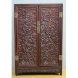 A Chinese cabinet in hardwood 'dragons' (50x96x145cm)