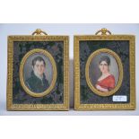 A pair of miniatures on ivory 'portraits' with a bronze frame, 19th century (4x6cm)