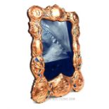 A large easel back copper and enamel picture frame.