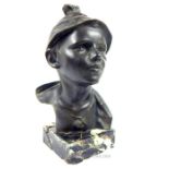 A bronze bust of a boy wearing a hat signed to reverse on marble plinth