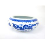 A Chinese blue and white bowl with dragon decoration, marks to base