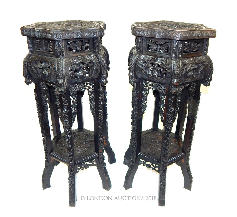 A pair of carved wood Chinese export jardiniere stands