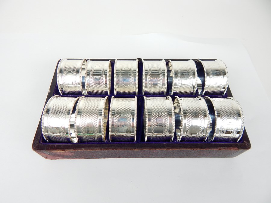 A Set of Twelve Silver Plated Napkin Rings.