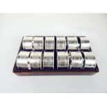 A Set of Twelve Silver Plated Napkin Rings.