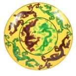 A Chinese Imperial yellow plate decorated with dragons with seal mark to base