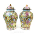 A pair of large famille rose vases and covers