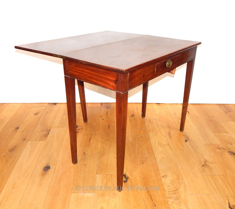 A George Mahogany Tea Table.