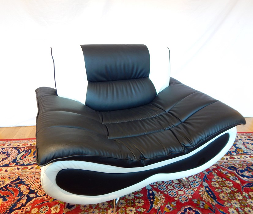 A Contemporary Black and White Leather Armchair.