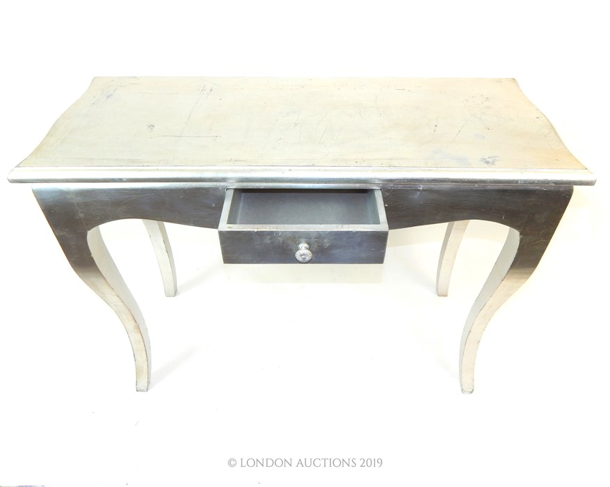 A silver console table