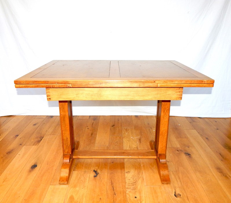 A two leaf oak extending table.