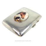 A silver cigarette case.