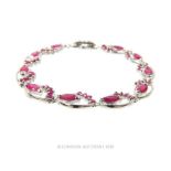 A Silver and Ruby bracelet.