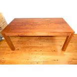 A teak dining room table.