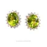 A pair of 18 carat Peridot and Diamond cluster earrings.