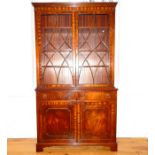 A mahogany regency style bookcase on cupboard base.