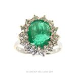 An 18 carat White Gold Emerald and Diamond ring.