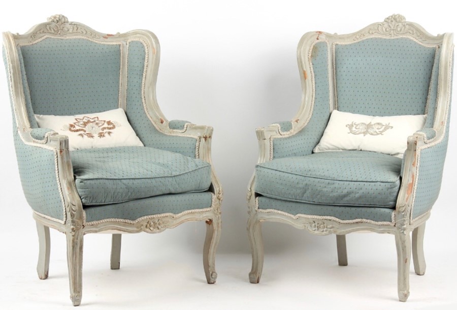 A Pair of 19th CENTURY LOUIS XV UPHOLSTERED WING BACK FAUTEUILS.