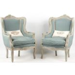 A Pair of 19th CENTURY LOUIS XV UPHOLSTERED WING BACK FAUTEUILS.