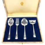 A set Gorman & Co. American sterling silver servers with fancy handles,