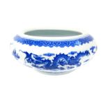 A Chinese blue and white bowl with dragon decoration, marks to base
