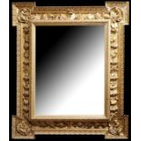 Pietro Giusti (Italian 1822-1878) AN IMPRESSIVE EARLY 19TH CENTURY CARVED GILTWOOD MIRROR