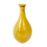 A pale yellow celadon glazed vase