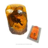 Faux Amber Paperweight With Insect And Faux Amber Mounted Chinese Ingot.