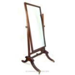 A fine Regency Mahogany Cheval Mirror.