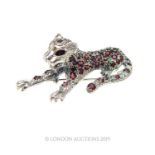 A Silver and Garnet Brooch/Pendant set in the form of a Leopard.