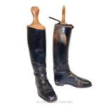 A pair of Leather Riding Boots with hardwood Trees.