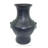 A large oriental Bronze Urn (damaged).