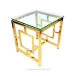 A Contemporary Gilt Metal Glass Top Occasional Table.