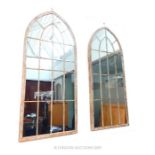 A Pair of Contemporary Metal Garden Mirrors.