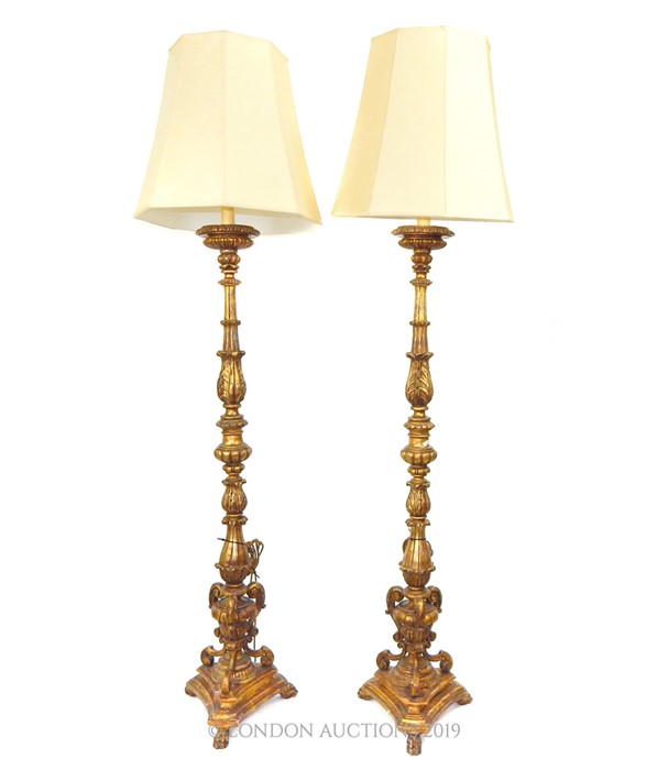An Italian carved gilt wood standard lamp.
