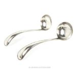 A Pair of Dutch Sterling Silver Bead Pattern Sauce Ladles.